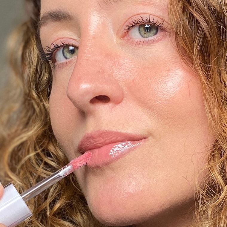Close up of Pro Artist Hollie applying Extra Plump Lip Serum to lips